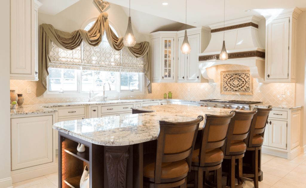 Kitchen remodel with white cabinetry, large island, and dark wood bar stools