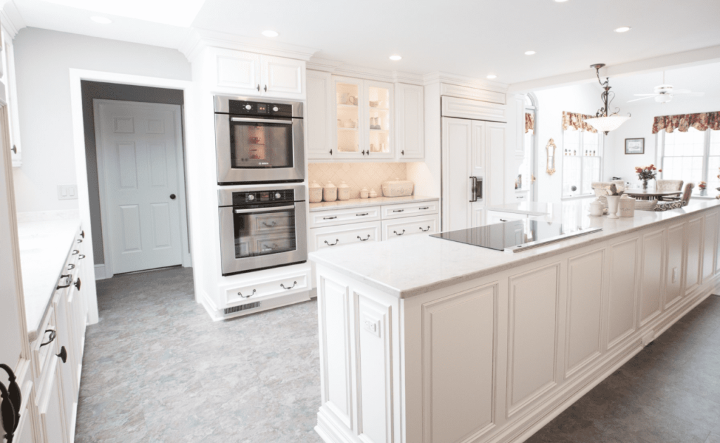 Large white kitchen with island in the center