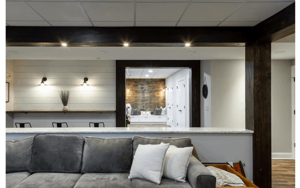 living room renovation with dark brown wooden beams pendant lighting large mirror