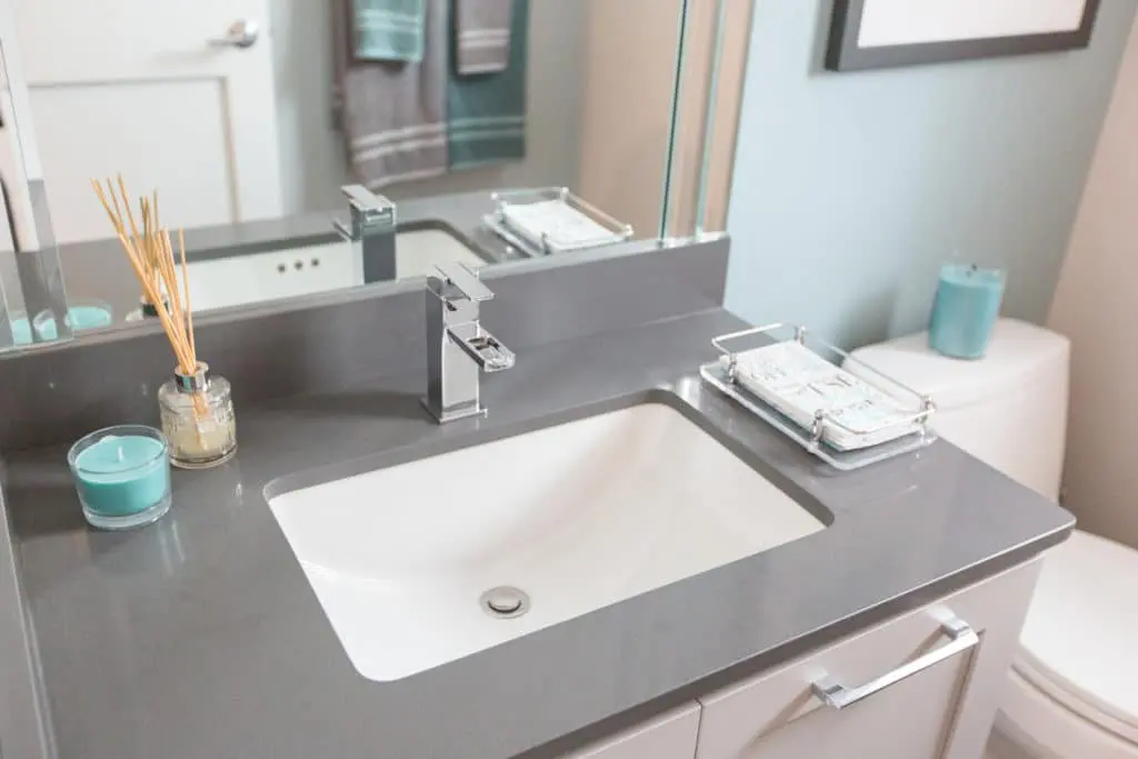 Minimalist bathroom remodel with grey and white theme