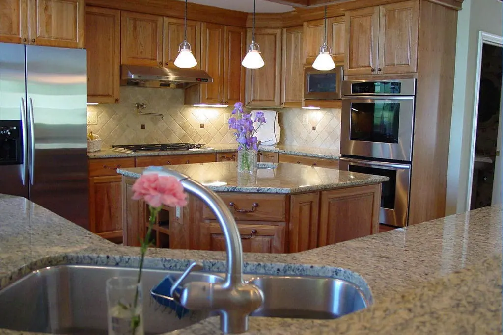 Warm kitchen remodel with haxagonal island.