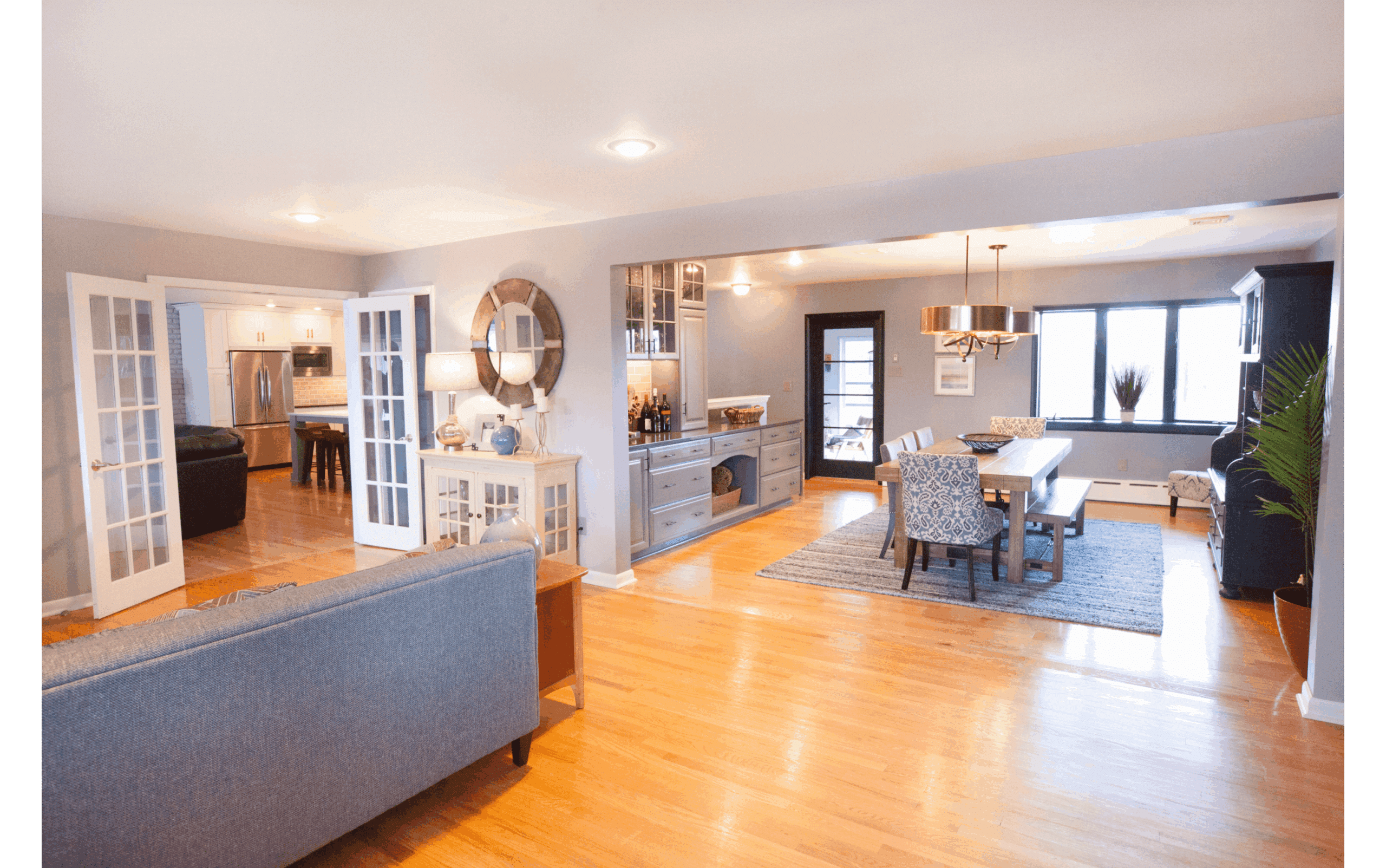 Remodeled open-concept living area, open to dining area and kitchen. Wood floors, recessed lighting.