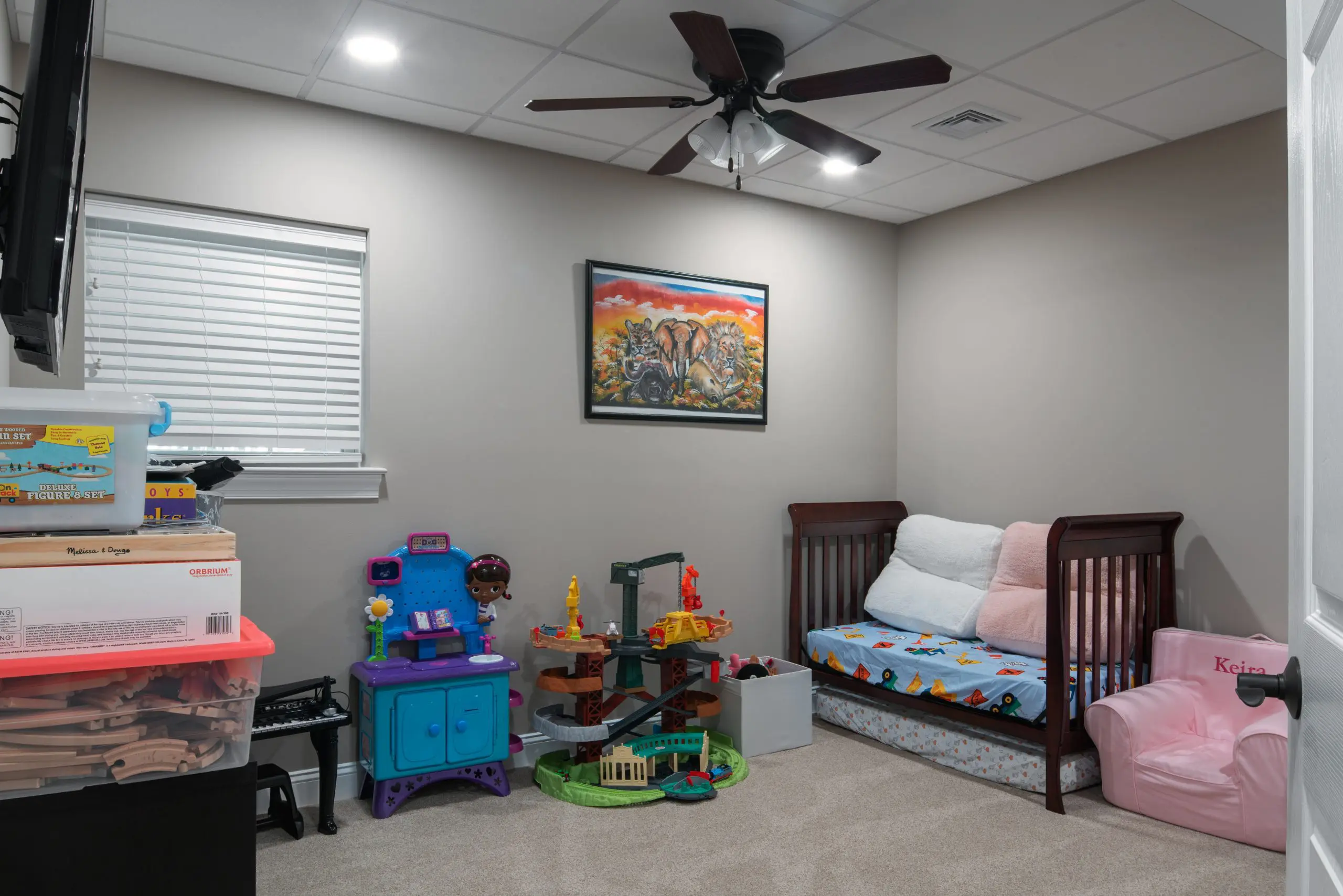 A remodeled basement purposed into a kids room
