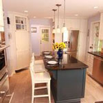 two tone cabinets with kitchen island and barstools