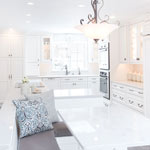 white kitchen cabinets on with banquette seating