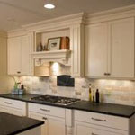 kitchen remodel with recessed lighting and subway tile backsplash on tall white cabinetry