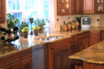 dark wood cabinets and granite countertops in kitchen