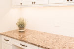 granite countertops and white cabinetry