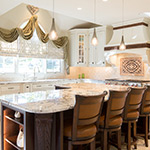 large island in kitchen with drapes over the window