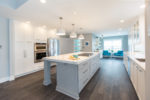 bright kitchen remodel with stainless steel appliances and marble countertops