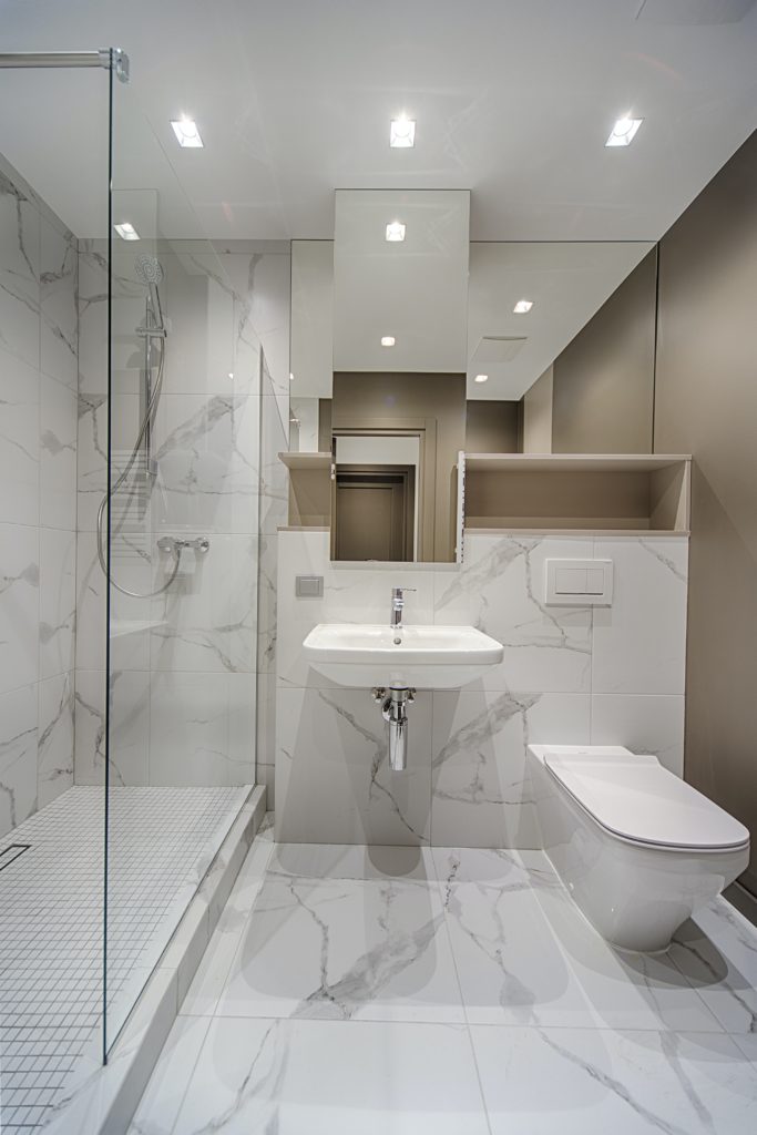 Beautifully created bathroom addition with new walk-in shower, sink, and toilet.