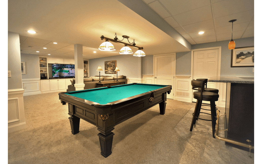 Large updated basement with bar, pool table, and built-in entertainment space