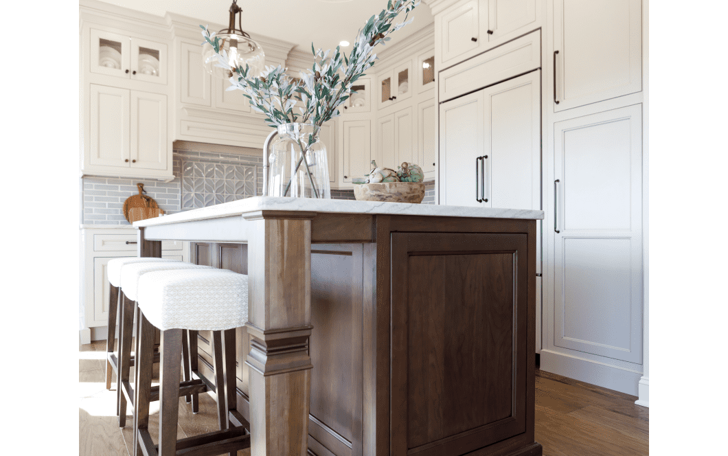 Rich statement wooden kitchen island with detailed carved legs in bight updated kitchen