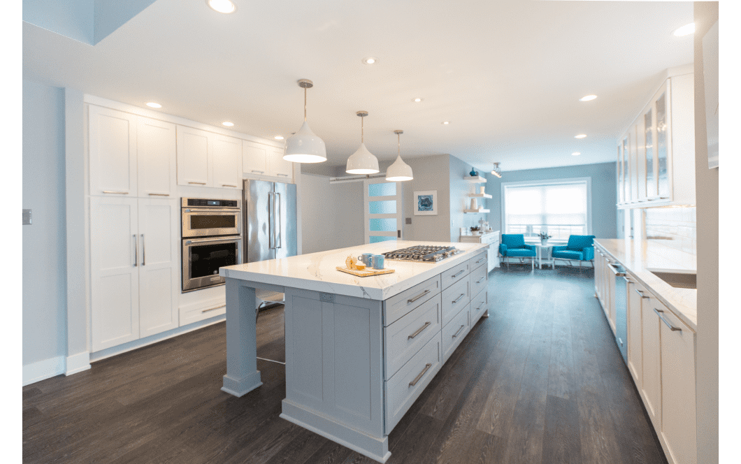 Large bright kitchen with extensive center island and floor-to-ceiling cabinet storage
