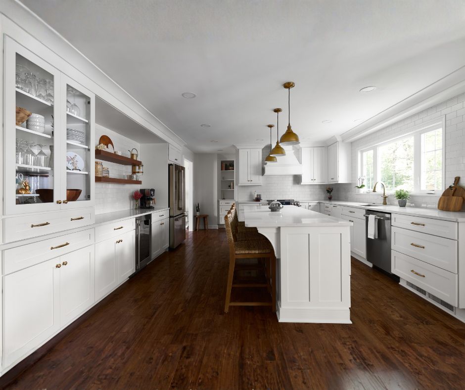 A renovated walk-in shower with tan brushed tile and granite bench.
